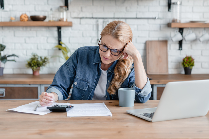 Woman reviewing documents on desk