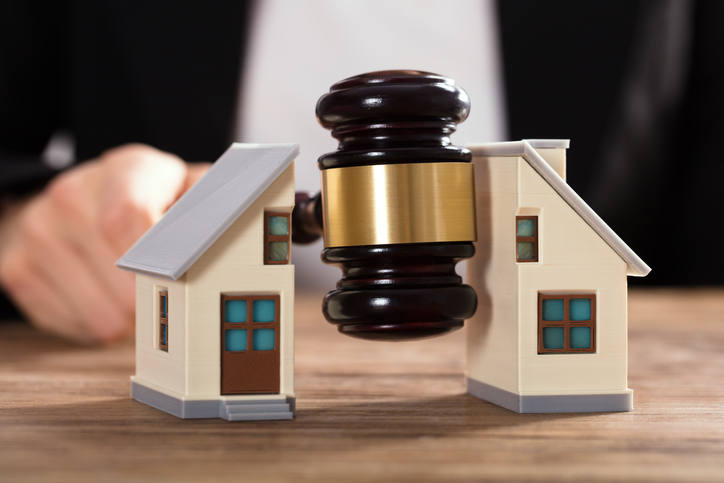 Gavel being split between a house
