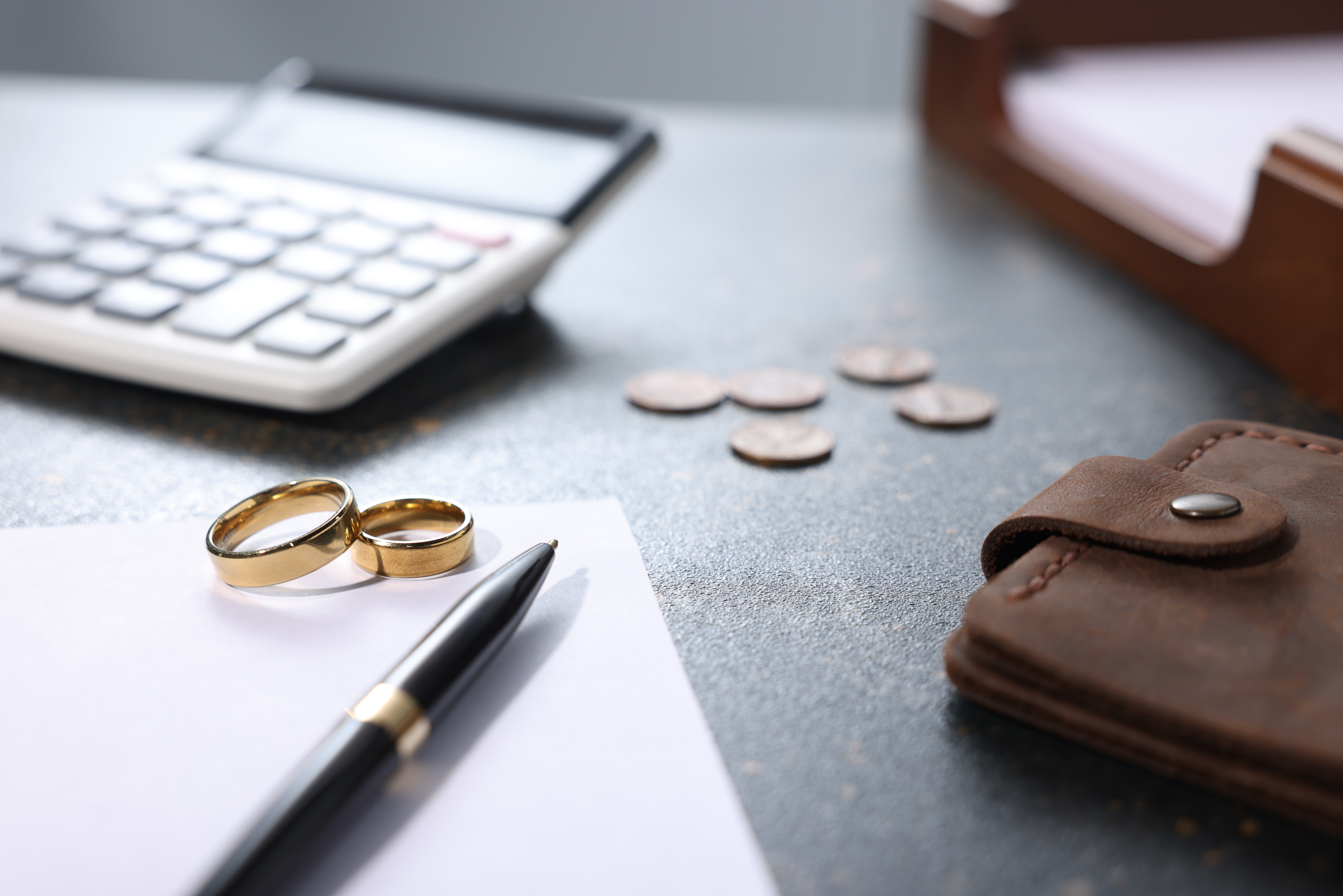 Wedding rings next to a calculator