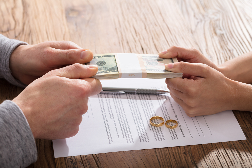 Couple fighting over money during divorce settlement